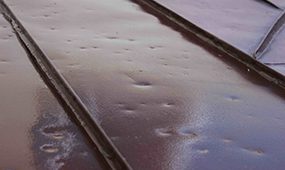 metal-roof-hail-damage-va - The Roof Coating Company commercial roof hail damage systems williamsburg va